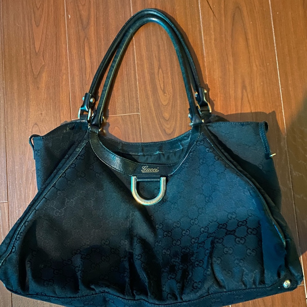 Gucci black handbag. Used. Signs of wear. Sold as is. Look at pictures